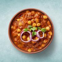 Tangy Garbanzo Curry · Chickpeas, cooked in an onion and tomato curry with Indian whole spice.