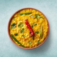 Tempered Yellow Lentils  · Yellow lentils cooked with Indian spices, herbs and topped with coriander sprinkle on it.