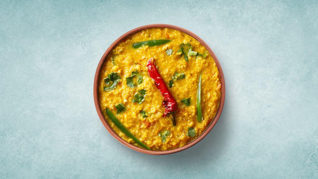 Tempered Yellow Lentils  · Yellow lentils cooked with Indian spices, herbs and topped with coriander sprinkle on it.