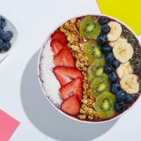 Fresh And Fruity Acai Bowl · Refreshing acai topped with granola, bananas, strawberries, blueberries, kiwi, shredded coco...