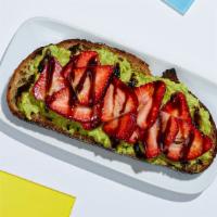 Strawberry Avocado Toast · Smashed avocado on whole wheat toast topped with strawberries and balsamic.