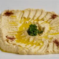 Hummus · Hummus, 1 falafel, sumac, olive oil. +1 pita bread