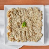 Baba Ghanoush (Eggplant hummus) · Grilled mashed eggplant, tahini, yogurt, lemon juice, garlic, olive oil, spices. + pita bread