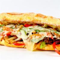 Philly Cheesesteak Sandwich · Savory thinly sliced steak, melted jack cheese, grilled onions, and bell peppers stuffed in ...