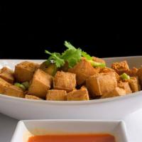 Fried Tofu · Deep-fried soft tofu seasoned and served with tangy chili sauce.