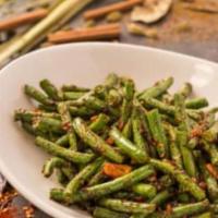 Ruby String Beans · String beans served with garlic and ginger in a soy-based sauce.