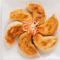 S17- House Made Pork Pot Stickers (6) with Sesame Soy Ginger Sauce · 