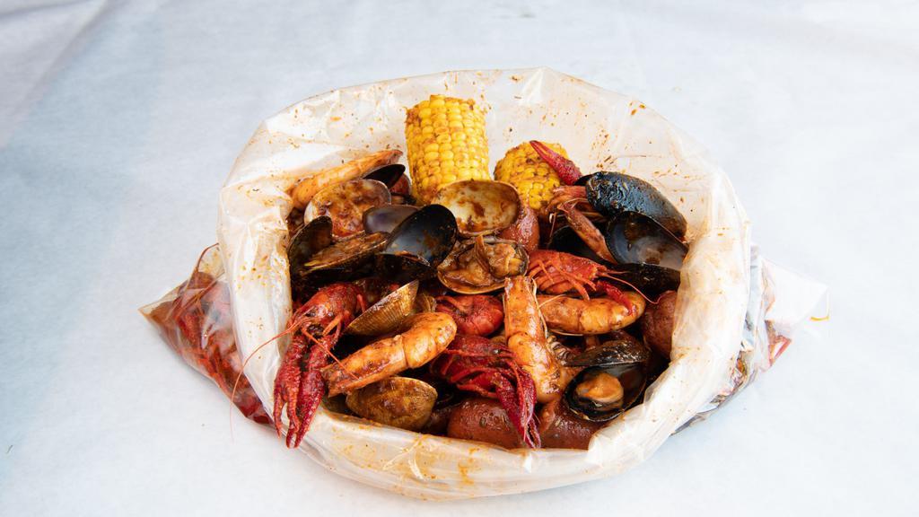 Combo #1 · Pick 3 from Below: Clams (1lb), Mussels (1lb), Crawfish (1lb), Shrimp Head On (1lb), Shrimp w. Head off (1lb) for an additional charge. Combo Includes: 2 Corns, 2 Potatoes & 4 pcs Sausages.