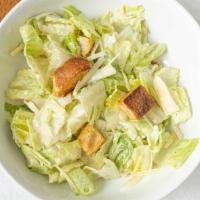 Caesar · Romaine, croutons, shaved parmigiano and house caesar dressing.