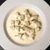 Gnocchi · Homemade potato dumpling in gorgonzola sauce.
