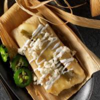 Tamale Asado · Your Choice of Tamale grilled and wrapped with cheese loaded with sour cream, refried beans ...