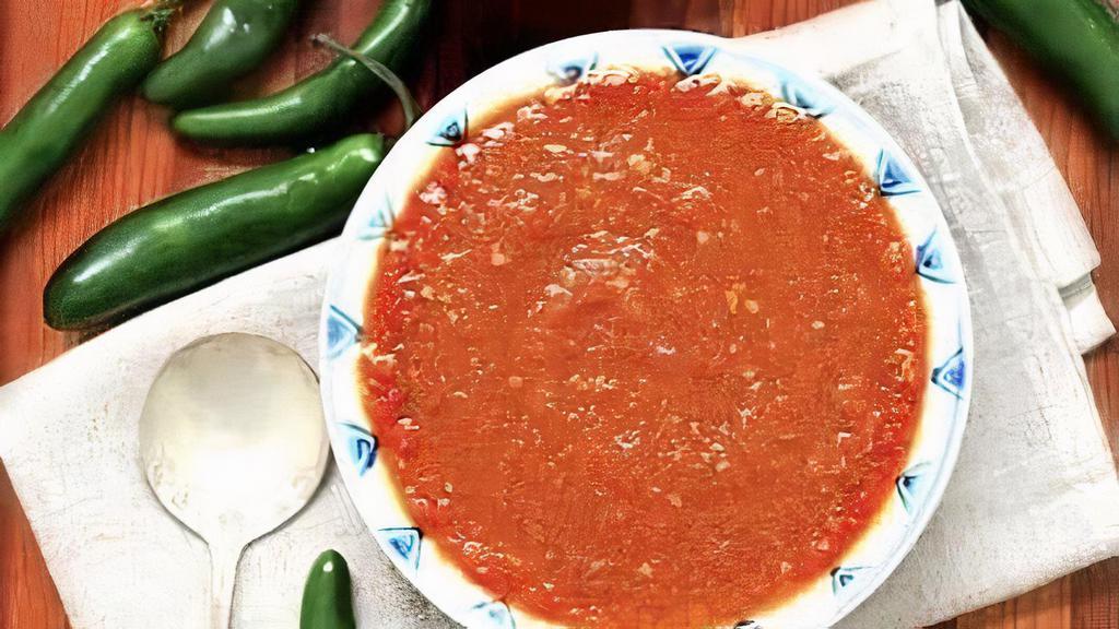 Salsa Roja 🌶🌶 · Side of our spicy salsa roja made with EVOO*<br /><br />Extra Virgin Olive Oil