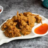 Chicken to Distraction (Crispy Chicken) · Vegan chicken fried until golden crisp and served with house sweet & sour sauce.