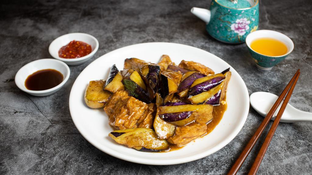 Let's Satay Together (Eggplant Tofu) · Eggplant, and fried tofu stir fried in a satay peanut sauce. Garnished with basil.