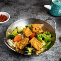Basil Do it For You (Basil Tofu) · Fried tofu cooked with mixed vegetables, and garnished with basil