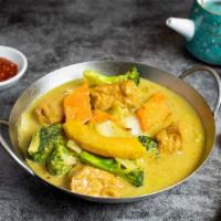 Give 'Em Pumpkin to Talk About · Market pumpkin, tofu, and mixed vegetables cooked in a curry. Gluten Free.