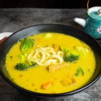 Udon Even Know (Curry Ramen) · Assortment of tofu, vegetables and noodles cooked in a curry ramen broth.