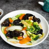 Veggie for the Weekend · Wild mushrooms, napa cabbage, fresh baby corn, broccoli, and fungus cooked in a light gravy....