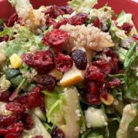 Quinoa Pear Salad · Lettuce, field greens, cucumber, corn, and dried cranberries, tossed with a champagne vinaig...