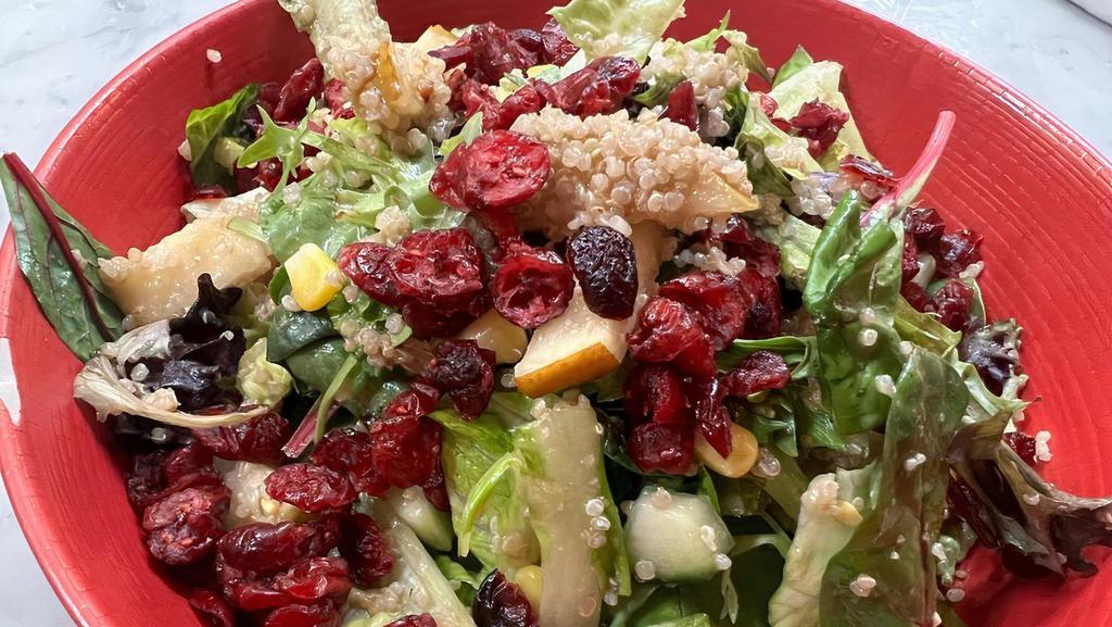 Quinoa Pear Salad · Lettuce, field greens, cucumber, corn, and dried cranberries, tossed with a champagne vinaigrette.