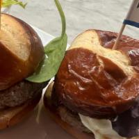 Impossible Sliders · Two Impossible meat sliders on mini pretzel buns with provolone cheese, cajun aioli, field g...