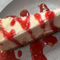 New York Cheese Cake · With strawberry purée.