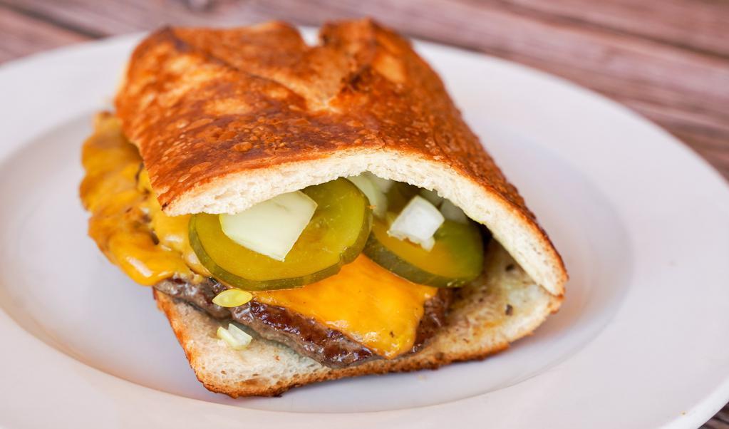 Double Cheeseburger · Burgers come with mustard, cheddar cheese pickles and onions served on a San Francisco sourdough roll
