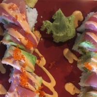 8. Raider Maki (8 Pieces) · Deep fried asparagus, spicy crab meat topped with tuna, avocado, spicy sauce, and tobiko.