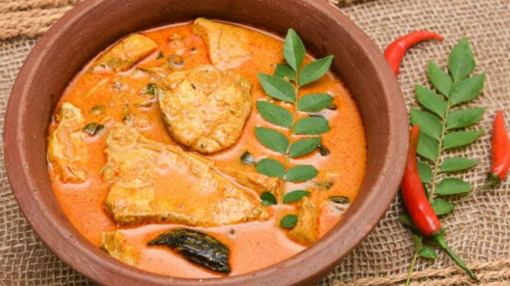 Malabar Fish Curry · Mouth watering dish made with fresh fish, tamarind puree, grated coconut, chilies, and exotic spices.