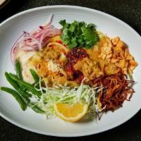 Nan Gyi Dok · Our version of a classic burmese noodle dish, flour noodles with coconut chicken curry sauce...