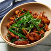 Ginger & Chili Pork · Tender pork belly tossed with garlic, ginger, Thai chiles, soy sauce and green onions.