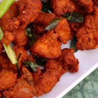 Chicken Pakora · Pieces of chicken dipped in chickpea batter and deep-fried.