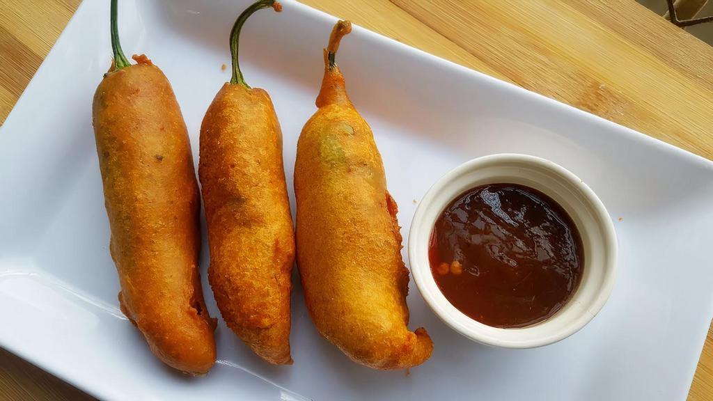 Chili Pakora · Chili dipped in chickpea batter and deep-fried.