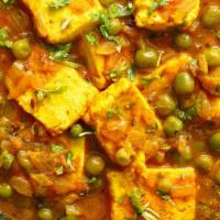 Matar Paneer · Green peas cooked lightly with homemade cheese.
