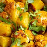 Aloo Gobi · Potatoes and cauliflower cooked with spices.