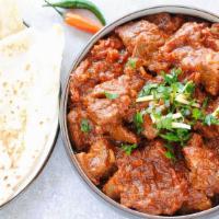 Karahi Lamb · Lamb cooked with onions and bell peppers in a spicy sauce.