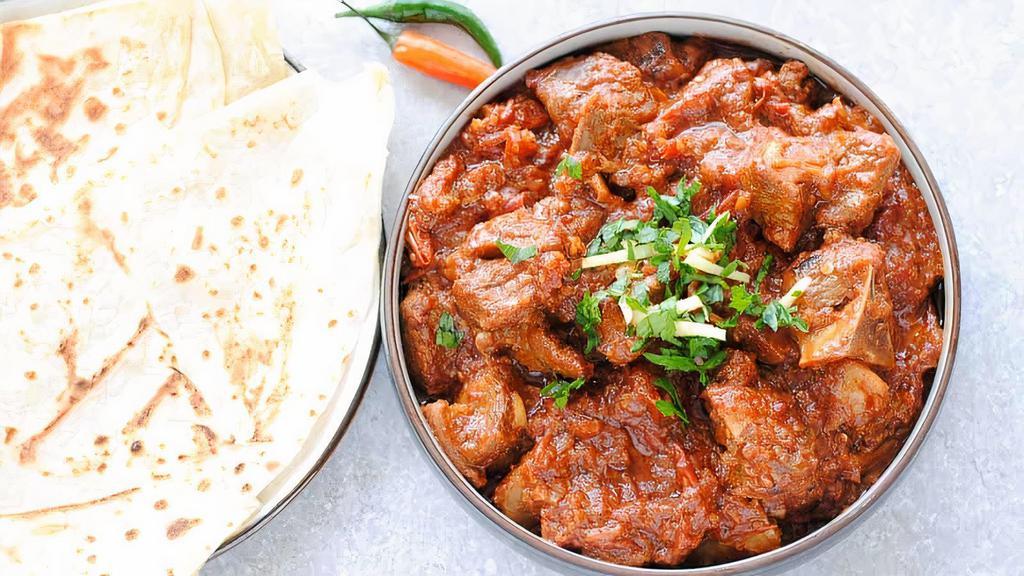 Karahi Lamb · Lamb cooked with onions and bell peppers in a spicy sauce.