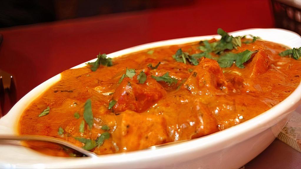 Butter Chicken · Shredded roasted chicken in tomato and butter cooked with creamy sauce.