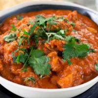 Karahi Chicken · Chicken cooked with onions and bell peppers in a spicy sauce.