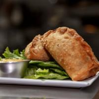 Samosas · Vegan, popular. Two delicious fried pastries filled with potato pea curry and served with th...
