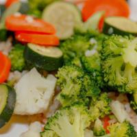 Steamed Vegetables · A medley of carrots, zucchini, cauliflower, and broccoli served over brown rice with lemon b...