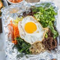 Bibimbap · Rice topped with seasoned vegetables carrots, radish, spinach, zucchinis, and your choice of...