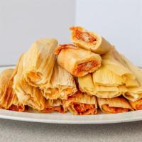 Chicken Tamales · Shredded chicken cooked in guajillo sauce combined with soft masa harina, wrapped in corn hu...