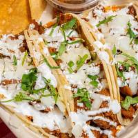 Street Tacos (3) · corn tortillas, choice of topping, onion, crema, cheese, cilantro