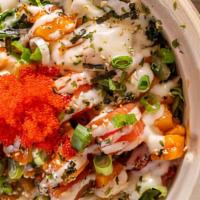 Island Poke · rice, soy marinade, choice of fish, seaweed salad, white onions, tobiko, pickled ginger, mis...
