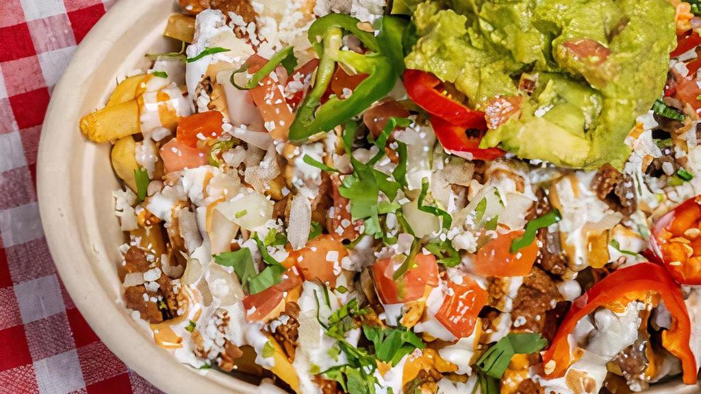 Saucy Asian Fries · choice of topping, crispy french fries, melted cheese, guacamole, crema, tomatoes, onions, jalapeño, garlic sauce, and kimchi chipotle aioli