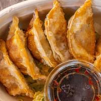 Potstickers · deep fried beef or veggie potstickers with homemade soy sauce mix