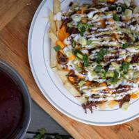 Birria Fries · French fries loaded with beef birria, shredded cheese and nacho cheese, sour cream, avocado ...