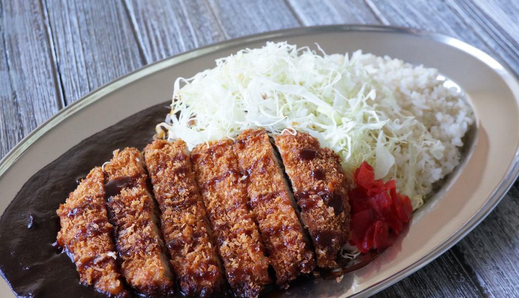 Pork Katsu Curry · Panko fried crispy pork cutlet curry with katsu sauce served with shredded cabbage, Fukujin-pickles and 50% milled brown rice