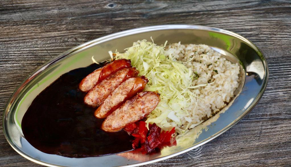 Japanese Sausage Curry · Arabaki Pork Sausage curry, which is juicy and has a slightly sweet and mild smoky flavor, served with shredded cabbage, Fukujin-pickles and 50% milled brown rice